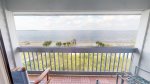 Balcony access from living room area delivers an an amazing water front view